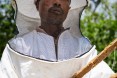 Practical training proves transformational. Abebaw Melesew used the training he received from USAID to turn around his beekeeping business. He is now a model farmer, training others to succeed in honey production.