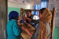 Natsaannat, a health extension worker in Wara Village, Ethiopia, counsels Aynamam on how to treat malnutrition in her child, Bitu.