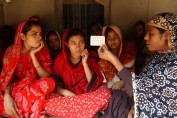 Photo of women learning about contraceptives.