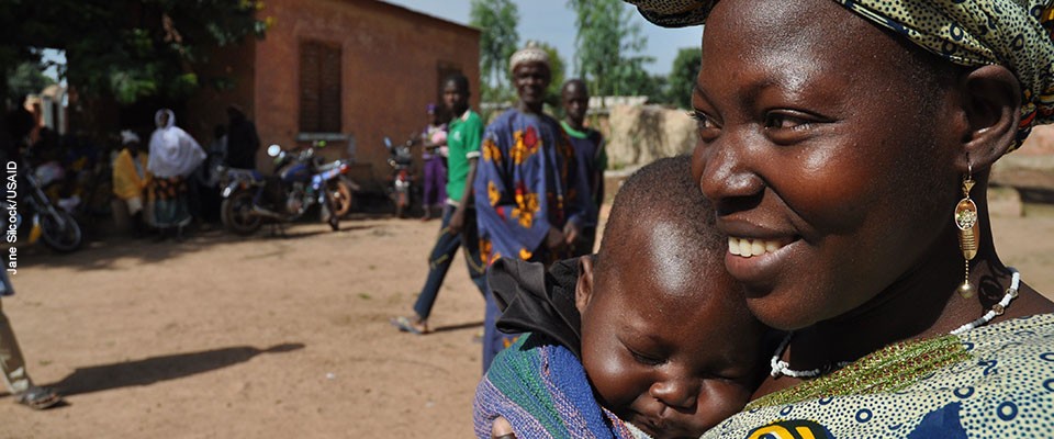 Photo of a smiling mother and her baby