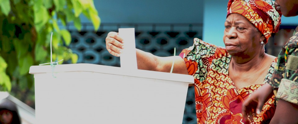 An old woman votng in the 2015 District Level Election in Ghana