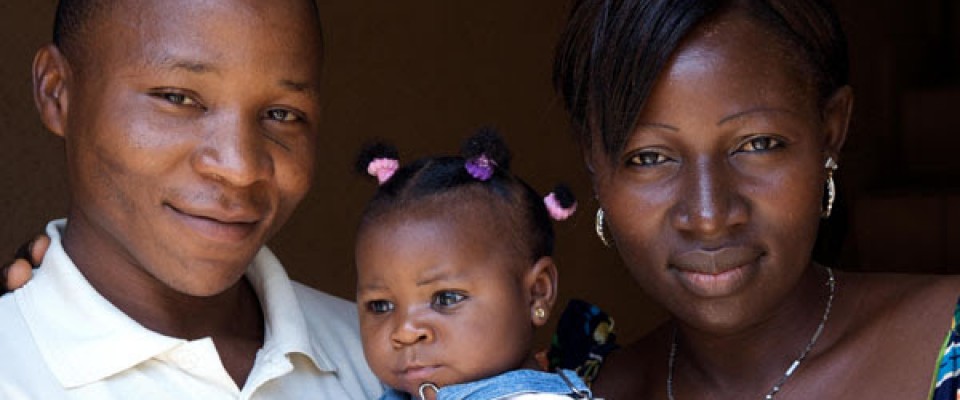 A couple holds their child