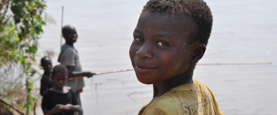 Boys fishing on the side of Vinho river in the Gorongosa National Park, center of Mozambique. 