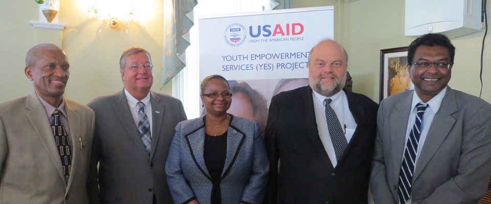 USAID Mission Director Christopher Cushing joins officials during the YES Project Launch in Guyana.