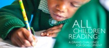 A boy practices reading and writing.