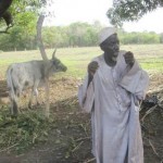 A herder celebrates the return of a stolen cow. 