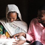 Nefisa and her husband with their 2-week-old daughter.