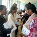 Elfinesh Duko (front left) explains the contents of the family health card to new volunteer community health workers.