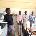 Tivo Abowro Chol describes the water quality testing process of her lab at the Wau Water Corporation.