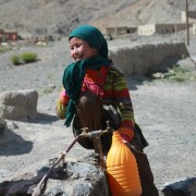 A girl retrieves water at a nearby water source in rural Morocco.