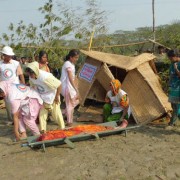 At a USAID-supported cyclone simulation, CPP volunteers practice search and rescue.