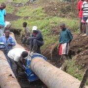 Workers fuse pipes together in Goma.