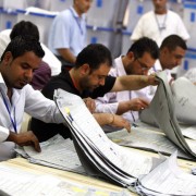 Iraqis count votes at the Independent High Electoral Commission headquarters in Baghdad on March 12, 2010.