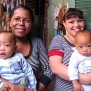 Odile Razafinganahary, right, holds one of her 5½ month old twins, Calist, while midwife Agnes Haingo holds Damas. The twins wer