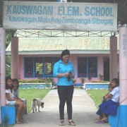 Lolita Singahan outside her school. 