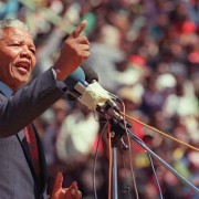 Anti-apartheid leader and African National Congress member Nelson Mandela speaks at a funeral for 12 people who died during town