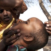 On July 29, 2011, a girl receives a de-worming tablet in the village of Malayley