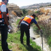 USAID project staff regularly test the water downstream to check for traces of slurry.