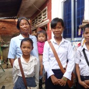 Miean Keng and her grandchildren, ready for school