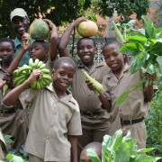 Farm attendant Rhoan Hepburn, rear, with fourth and fifth grade students in the breakfast feeding program at the Flanker Primar