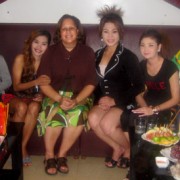 U.S. Rep. Laura Richardson (D-Calif.), center left, visits a SmartGirl Club and interacts with beneficiaries in a Karaoke parlor