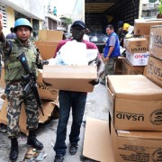 The International Office for Migration distributes aid on Feb. 18, 2010, in Port-au-Prince, Haiti. More than a million people we