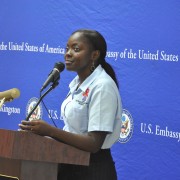 Tennesha Rhule conveys her story to members of the U.S. Embassy community at an HIV forum in 2012.