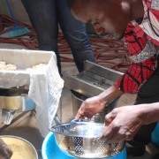 Tofu curds are placed into a form at the Savanna Agricultural Research Institute.