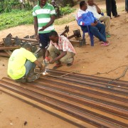 A local welder fabricates the photovoltaic array structure designed by GVE Projects.