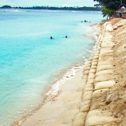 Resistant to punctures and ultraviolet rays, these sturdy, multiple-ply bags are filled with sand.