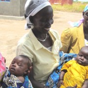 Left to right: Esther Maliga with daughter Jaminewa; Florence Lextion with daughter Alice Terewa; and Wilma Avowa, volunteer hom