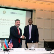 Ambassador Chahtahtinsky (left) and Chargé d’Affaires Hogan (right) shake hands after signing the declaration.