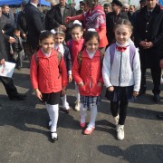 Schoolchildren walk on the newly renovated road.