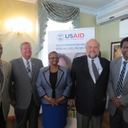 USAID Mission Director Christopher Cushing joins officials during the YES Project Launch in Guyana.