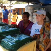 Mission Director gives out nets to waiting crowd