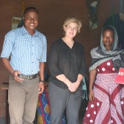 Mission Director Riley visits a program beneficiary's sewing workshop