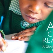 A boy practices reading and writing.