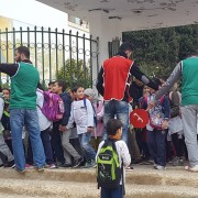 The dad-led School Brigade helps children safely cross the street to school