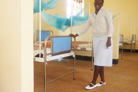 A nurse at the Kibaigwa Health Center shows off the newly completed women’s ward.